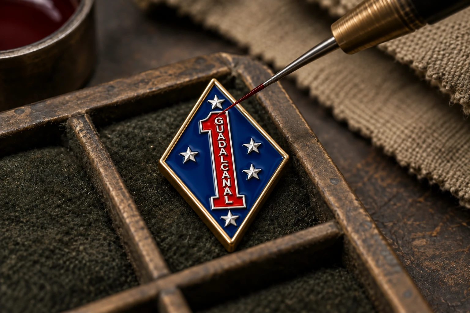 Illustrative view of red enamel being applied to the numeral 1 on a blue 1st Marine Division cufflink face